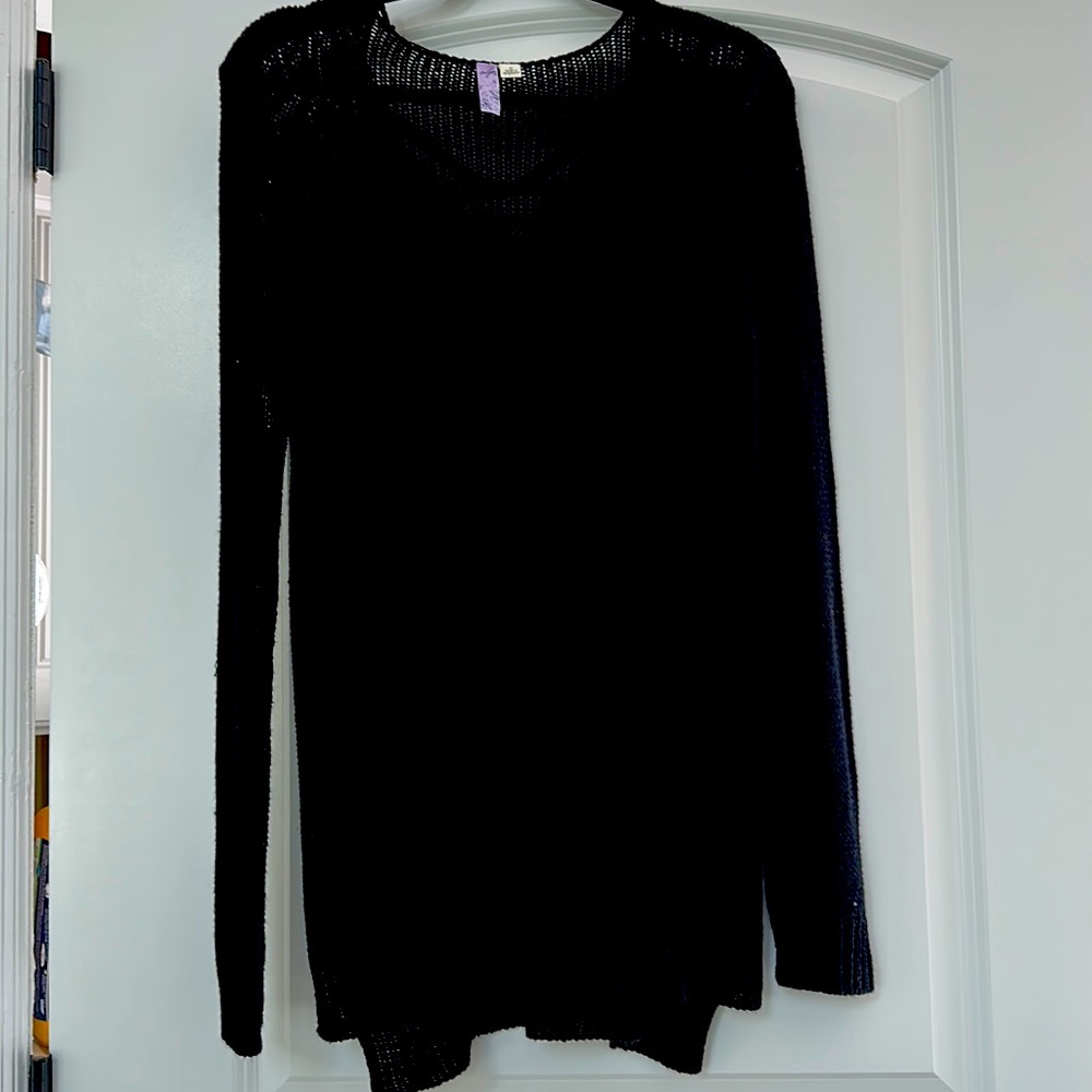 Black Knit sweater with small side slit.